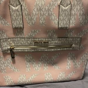 Barely used pink and white Michael Kors purse with dusting bag